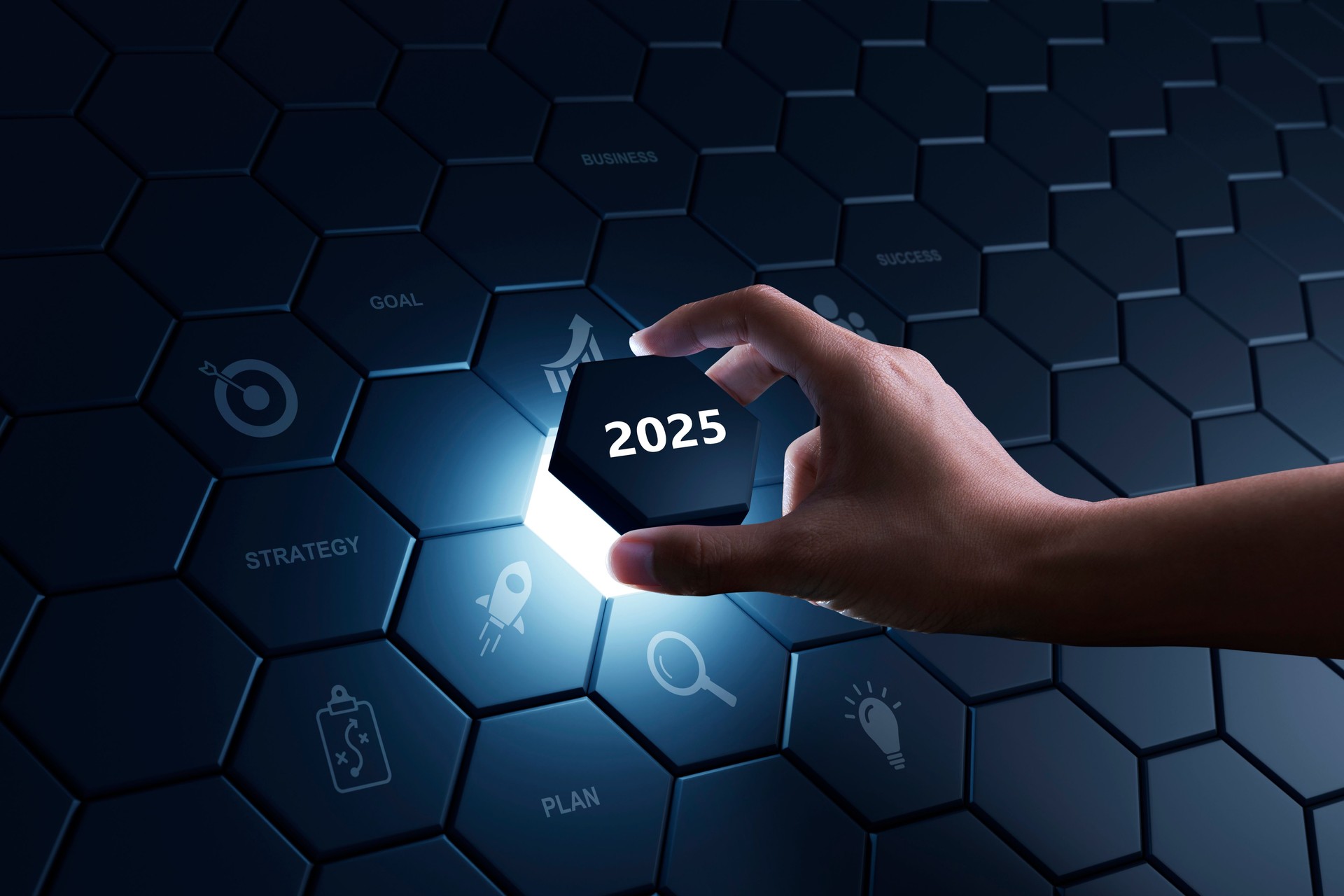 Hand of human putting hexagon piece to full fill the part of 2025.